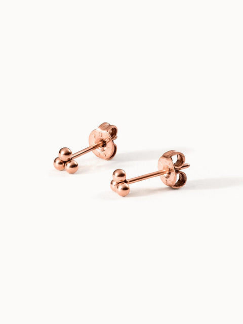 Roségoldene Ohrringe mit kugelförmigem Design von PURELEI, elegant und modern.