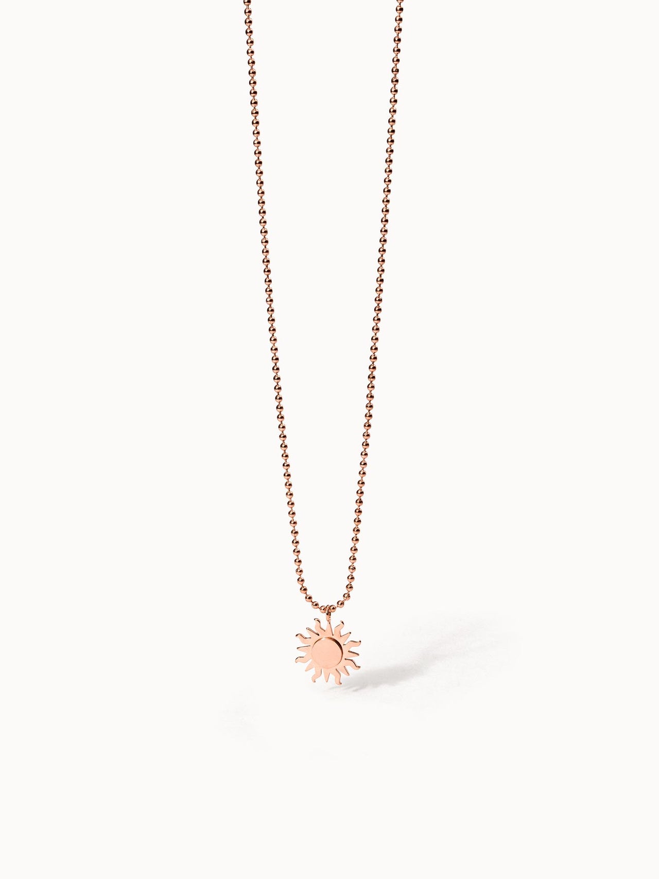 Roségoldene Kette mit Sonnenanhänger, PURELEI, elegant und strahlend.