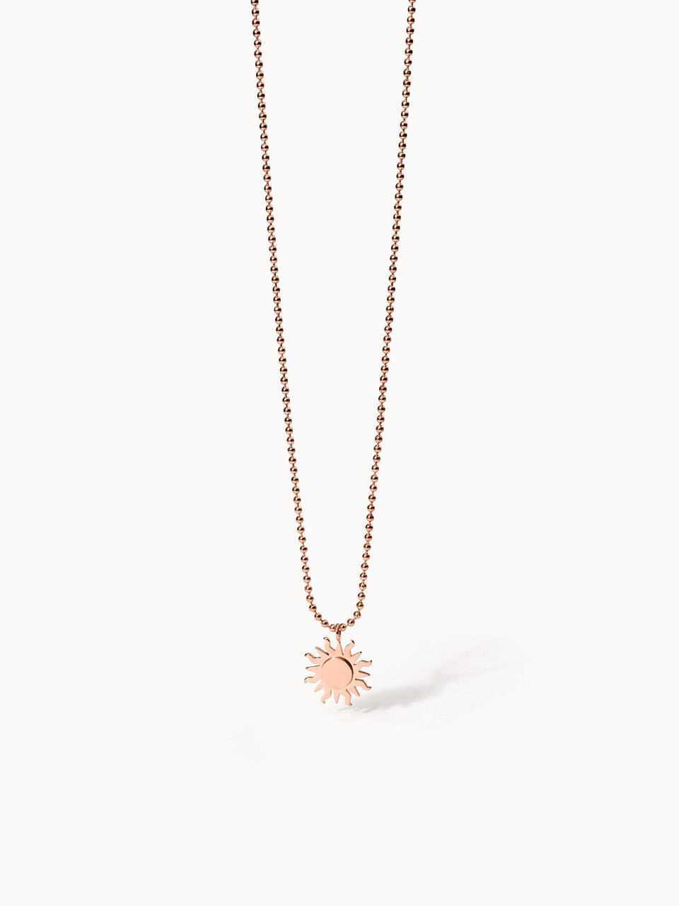 Roségoldene Kette mit Sonnenanhänger, PURELEI, elegant und strahlend.