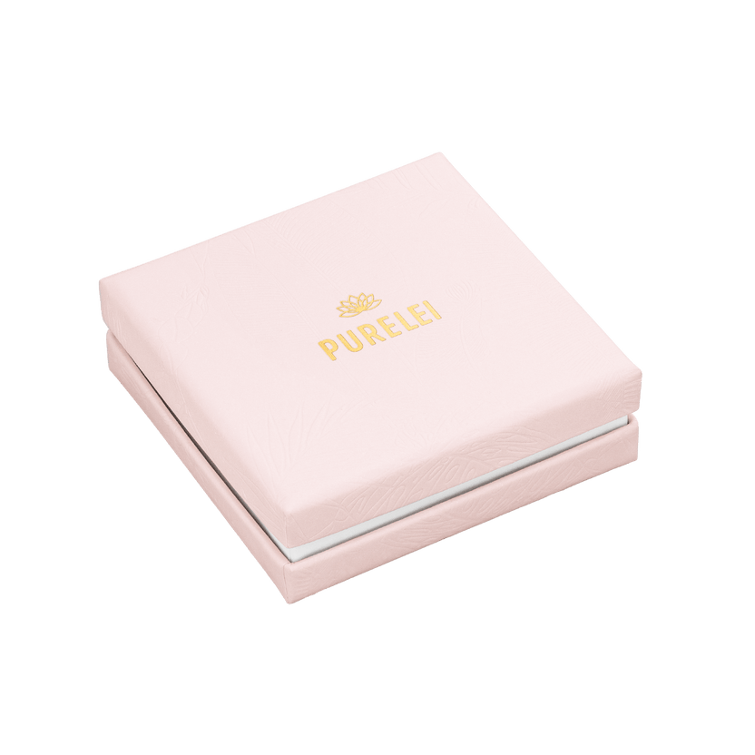 Elegante PURELEI Schmuckschachtel in zartem Rosa mit goldfarbenem Logo, edel und feminin gestaltet.