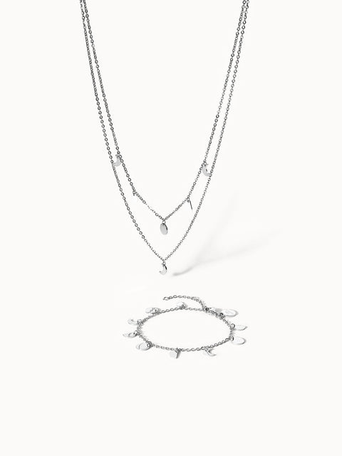 Silberne Kette und Armband mit Mondanhängern von PURELEI, elegant und modern.