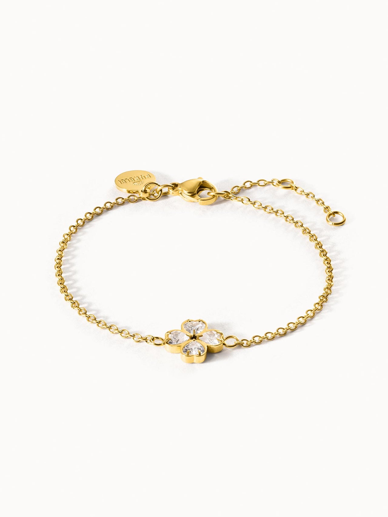 Goldenes Armband mit blütenförmigem Design und funkelnden Steinen von PURELEI.