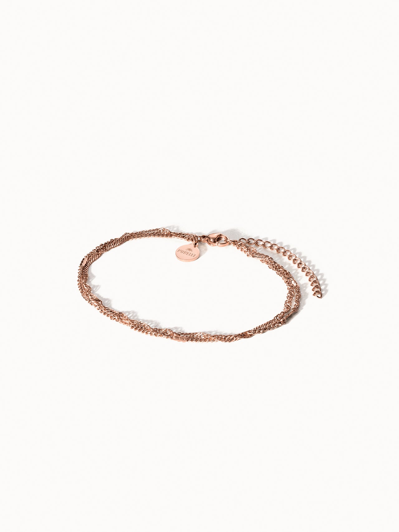 Authentisches Fußkettchen von PURELEI in Roségold, fein verflochten, elegant und nickelfrei getragen.