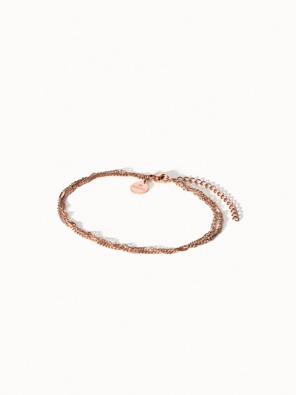Authentisches Fußkettchen von PURELEI in Roségold, fein verflochten, elegant und nickelfrei getragen.