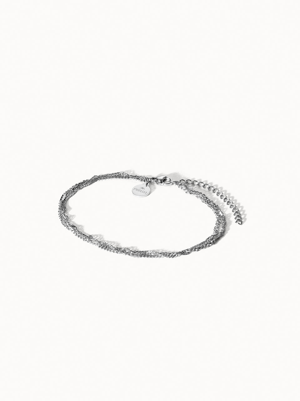 Authentisches PURELEI Fußkettchen in Silber, fein geflochten, nickelfrei und elegant minimalistisch präsentiert.