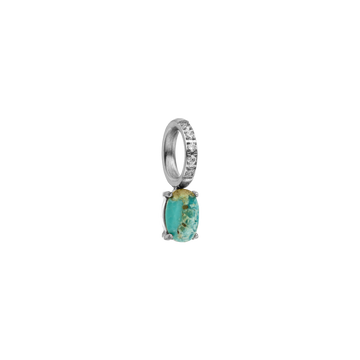 Silberner Ring mit türkisfarbenem Stein und funkelnden Details von PURELEI.