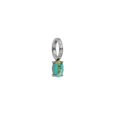 Silberner Ring mit türkisfarbenem Stein und funkelnden Details von PURELEI.