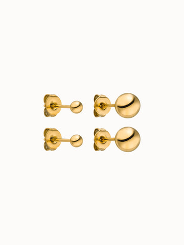 Goldene Ohrringe mit glänzenden Kugeldesigns von PURELEI, elegant und modern.