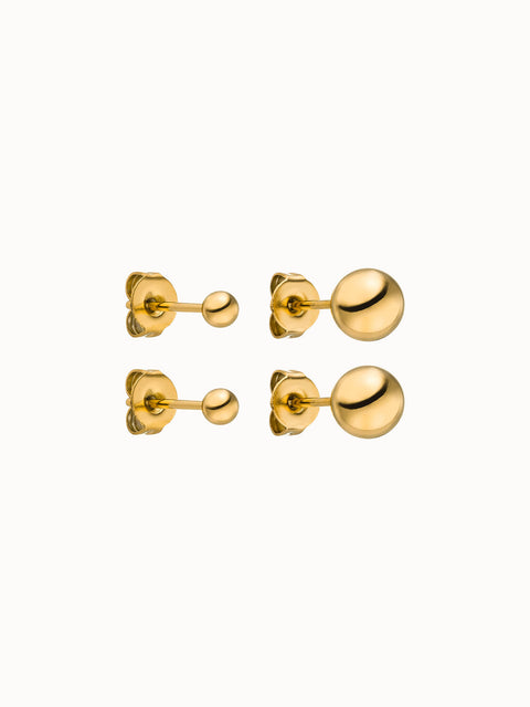 Goldene Ohrringe mit glänzenden Kugeldesigns von PURELEI, elegant und modern.