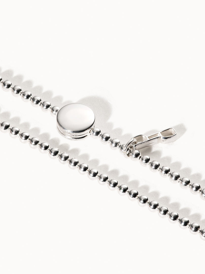 Essence Armband von PURELEI, elastisch aus recyceltem 925 Silber mit glänzenden Kugeln und Coin, elegant und schlicht.