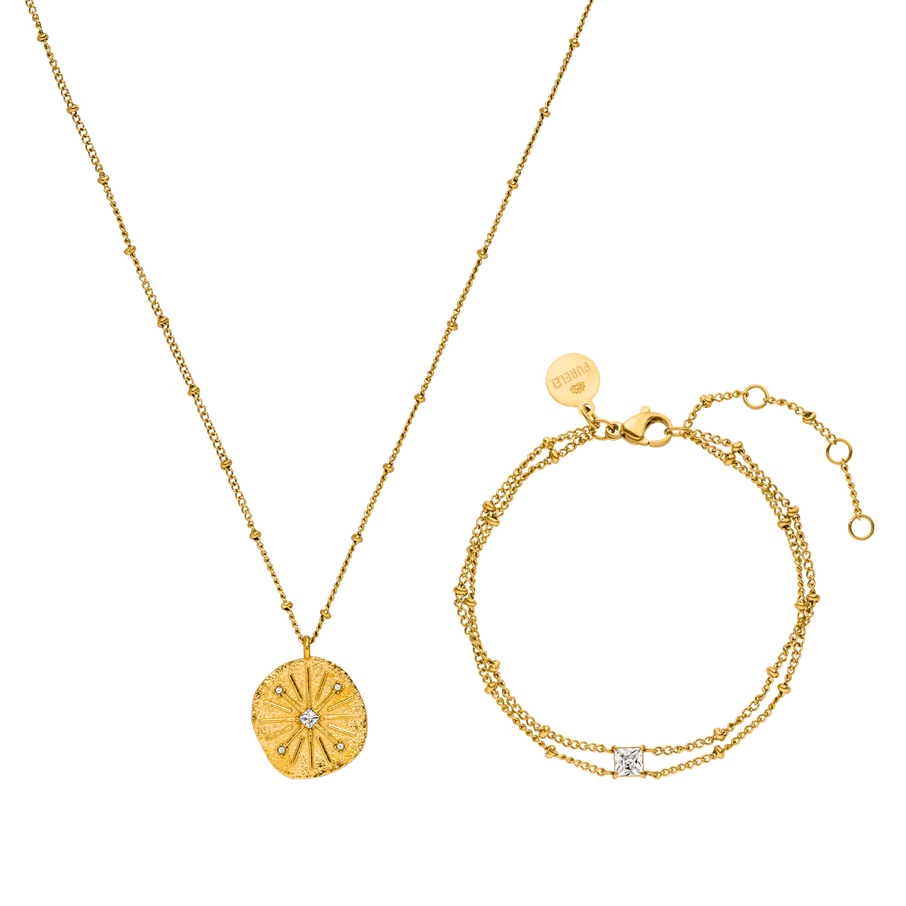 Goldene Kette mit Muschel-Anhänger und Armband, beide von PURELEI, elegant und feminin.