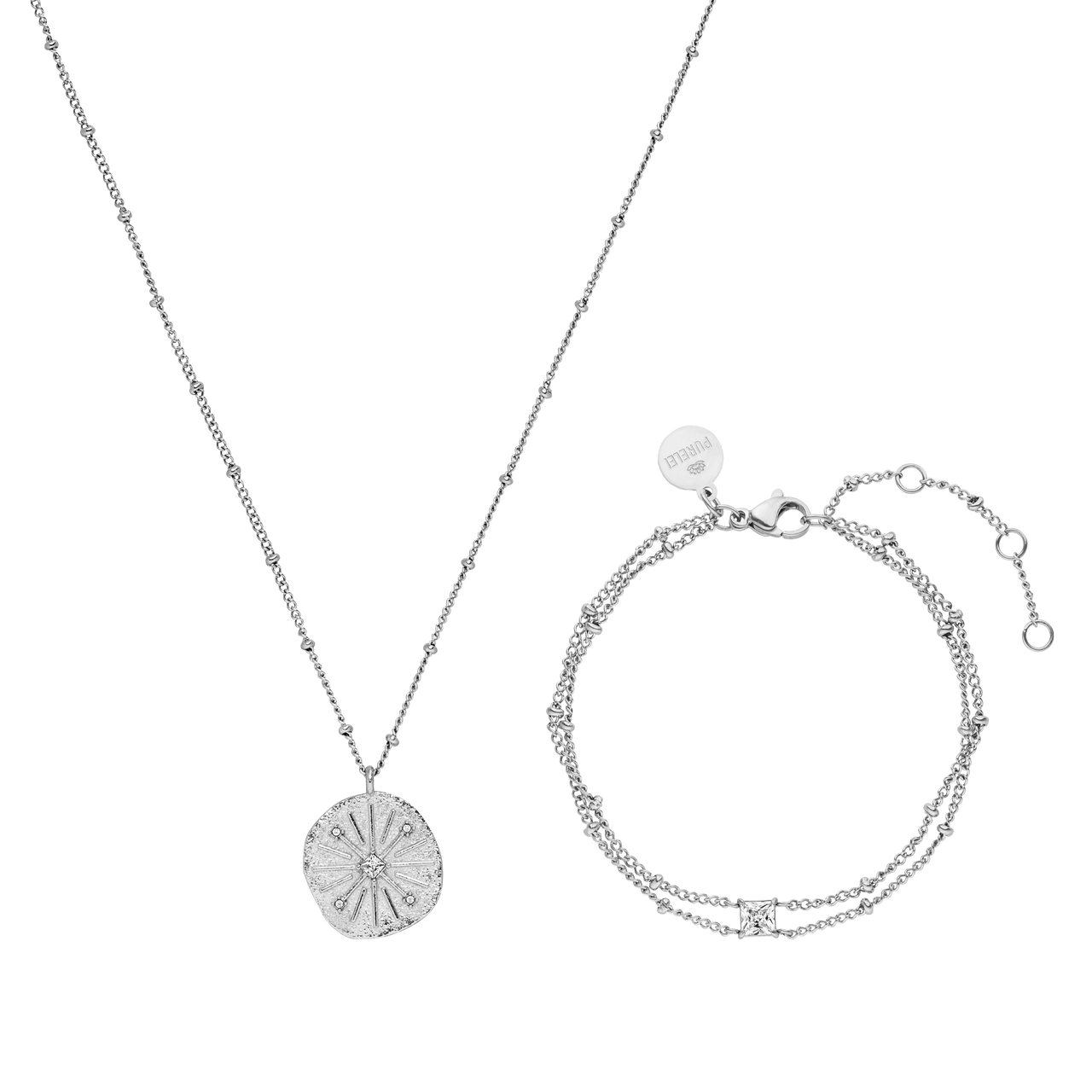Silberne Kette mit Muschel-Anhänger und passendem Armband von PURELEI, elegant und modern.