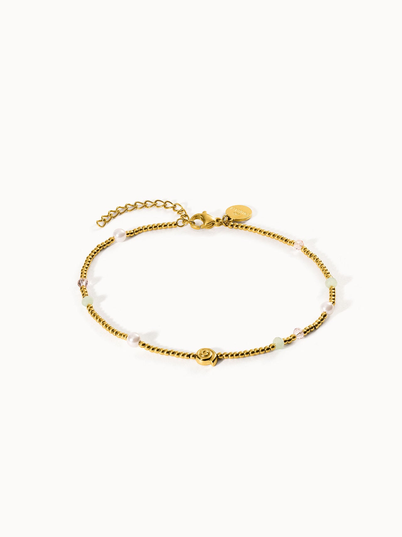 Goldenes Armband mit Perlen und bunten Akzenten von PURELEI, elegant und feminin.