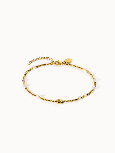 Goldenes Armband mit Perlen und bunten Akzenten von PURELEI, elegant und feminin.